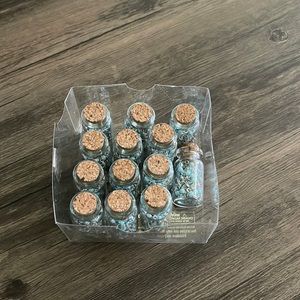 Set of 12 blue rosary’s in a bottle